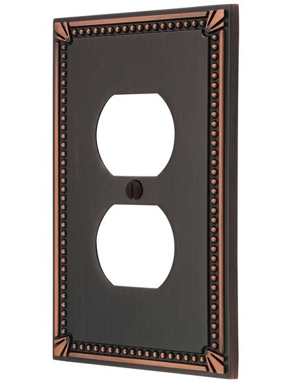 Imperial Bead Single Duplex Cover Plate in Aged Bronze.